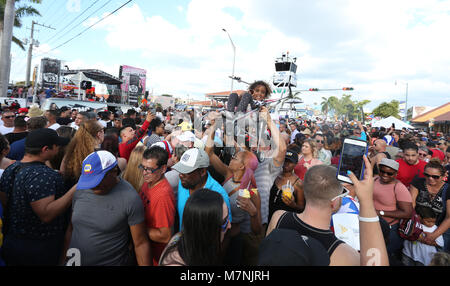 Miami, USA. 11th Mar, 2018. People attend the 41st annual Calle Ocho Festival on SW 8th Street in the Little Havana community as part of Carnaval Miami on March 11, 2018 in Miami, Florida.  (Photo by Sean Drakes/Alamy Live News) Credit: SEAN DRAKES/Alamy Live News Stock Photo