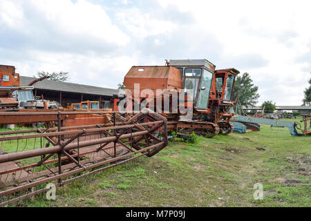 Old rusty disassembled combine harvester. Combine harvesters Agricultural machinery Stock Photo