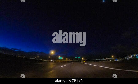 Driving on Interstate highway I25 at night. Stock Photo