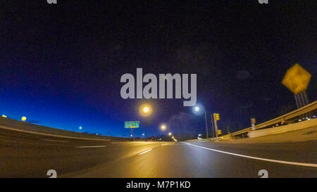 Driving on Interstate highway I25 at night. Stock Photo