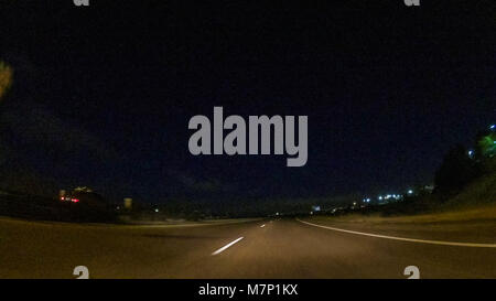 Driving on Interstate highway I25 at night. Stock Photo