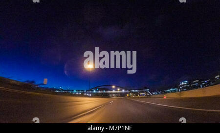 Driving on Interstate highway I25 at night. Stock Photo