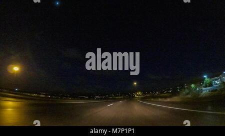 Driving on Interstate highway I25 at night. Stock Photo