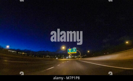 Driving on Interstate highway I25 at night. Stock Photo