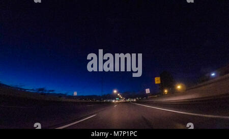 Driving on Interstate highway I25 at night. Stock Photo