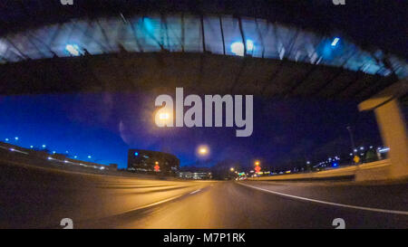 Driving on Interstate highway I25 at night. Stock Photo