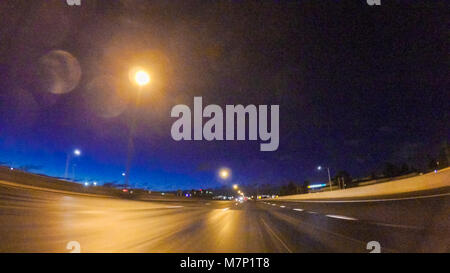 Driving on Interstate highway I25 at night. Stock Photo