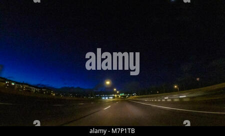 Driving on Interstate highway I25 at night. Stock Photo