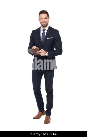 Young positive caucasian businessman holding clipboard, isolated on white, toothy smile Stock Photo