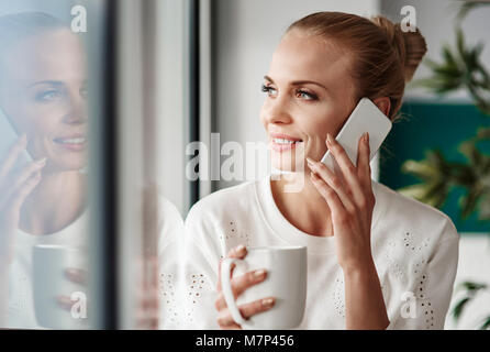 Cheerful businesswoman taking a break Stock Photo