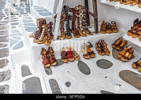 Shopping for handmade leather sandals Stock Photo