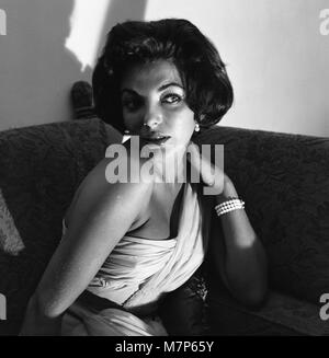 Joan Collins, actress, has recently returned from a holiday in the South of France, pictured at her flat in Marylebone, London, 2nd August 1957. Stock Photo