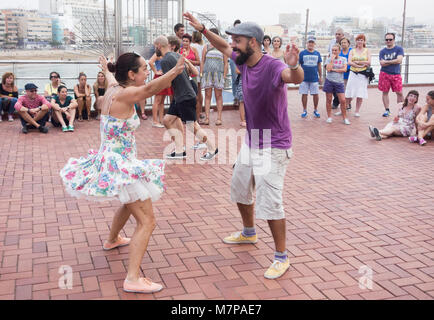 Swing Dancing outdoors overlooking city beach in Las Palmas on Gran Canaria, Canary Islands, Spain Stock Photo