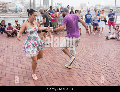 Swing Dancing outdoors overlooking city beach in Las Palmas on Gran Canaria, Canary Islands, Spain Stock Photo