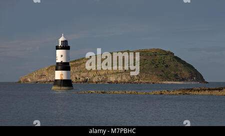 Penmon Point lighthouse and Puffin Island, Anglesey, North Wales coast Stock Photo