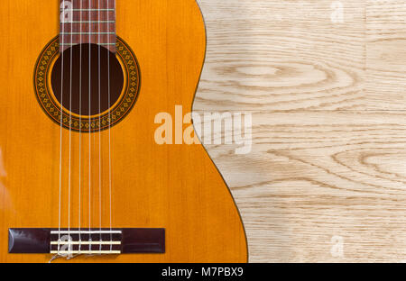 Classical guitar over a wood texture background Stock Photo