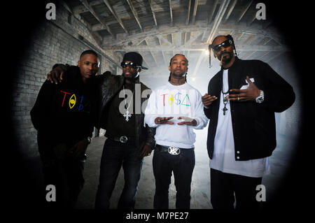 (L-R) YG, 50 Cent, TY Dolla Sign, and Snoop Dogg on-set portrait at the 'Toot It & Boot It Remix' Music Video on November 18, 2010 in Los Angeles. Stock Photo