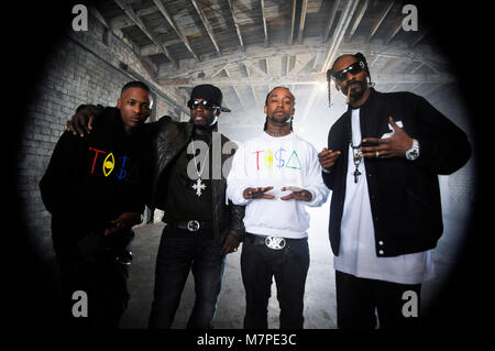 (L-R) YG, 50 Cent, TY Dolla Sign, and Snoop Dogg on-set portrait at the 'Toot It & Boot It Remix' Music Video on November 18, 2010 in Los Angeles. Stock Photo