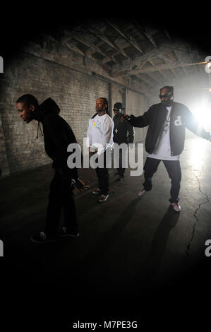 (L-R) YG, Ty Dolla Sign, 50 Cent and Snoop Dogg perform on-set at the 'Toot It & Boot It Remix' Music Video on November 18, 2010 in Los Angeles. Stock Photo