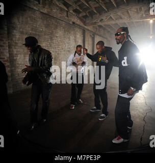 (L-R) 50 Cent, Ty Dolla Sign, YG and Snoop Dogg perform on-set at the 'Toot It & Boot It Remix' Music Video on November 18, 2010 in Los Angeles. Stock Photo