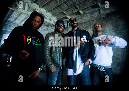 (L-R) YG, 50 Cent, Snoop Dogg and Ty Dolla Sign portrait on-set at the 'Toot It & Boot It Remix' Music Video on November 18, 2010 in Los Angeles. Stock Photo