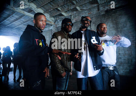 (L-R) YG, 50 Cent, Snoop Dogg and Ty Dolla Sign portrait on-set at the 'Toot It & Boot It Remix' Music Video on November 18, 2010 in Los Angeles. Stock Photo