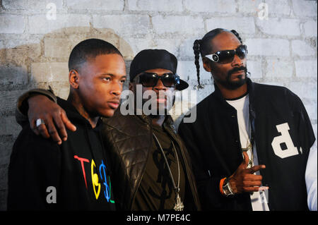 (L-R) YG, 50 Cent & Snoop Dogg on-set at the 'Toot It & Boot It Remix' Music Video on November 18, 2010 in Los Angeles. Stock Photo