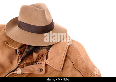 Classic combination of tan felt Fedora and leather jacket isolated on white (path provided). Stock Photo