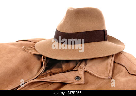 Classic combination of tan felt Fedora and leather jacket isolated on white (path provided). Stock Photo