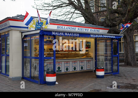 The Hague, Netherlands - January 3, 2017: Kiosk selling New Dutch Herring at Binnenhof. Dutchs eat their raw fish on a bun or as a snack with some cho Stock Photo