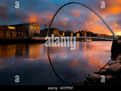 Now an icon of the River Tyne the Millennium Bridge from the south side (Gateshead) of the Tyne looking across the river to Newcastle quayside Stock Photo