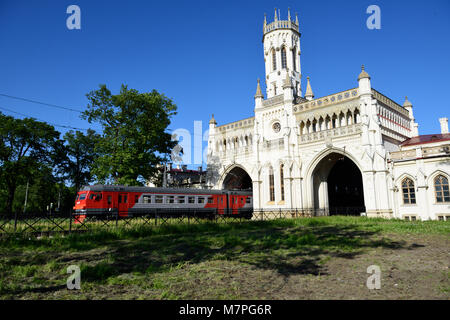 St. Petersburg, Russia - June 07, 2015: Commuter train departs from the train station Novy Peterhof. The station was built in 1854-1857 by design of N Stock Photo