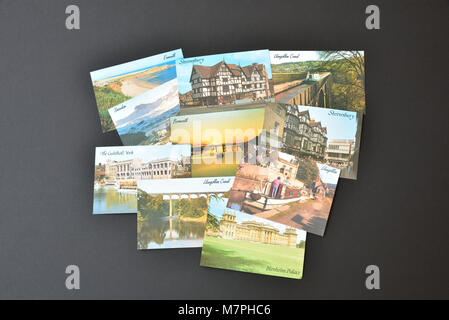 Ten J Salmon Ltd postcards depicting English and Welsh views, shown on a black background. Stock Photo