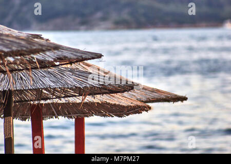 Sun loungers and umbrellas are on the beach in Budva, Montenegro. Stock Photo