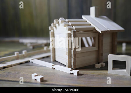 Toy wooden house. The constructor is made of natural wood for ch Stock Photo