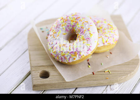 Donut on a wooden white background Stock Photo
