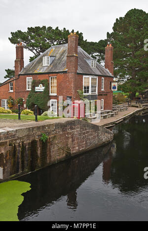 The Double locks Hotel and public house and beer garden situated on the banks of the Exeter canal on the Exe Valley Way in Devon England. Stock Photo