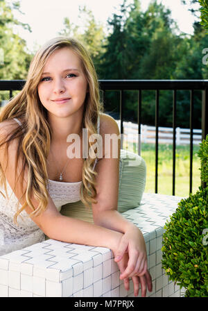 A portrait of a teenaged girl with long blonde hair. Stock Photo