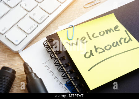 Welcome aboard written on a memo stick. Stock Photo