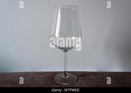 Simple wineglass on a textile table Stock Photo