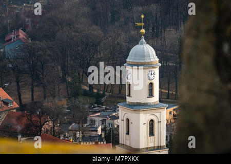 High clock tower of the Saint Jadwiga Catholic church in Bolkow town in Lower Silesia, Poland, as seen from the walls of the Bolkow castle Stock Photo