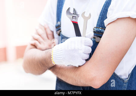 engineer hold equipment in hand to repair or maintenance equipment at factory in industrial zone Stock Photo