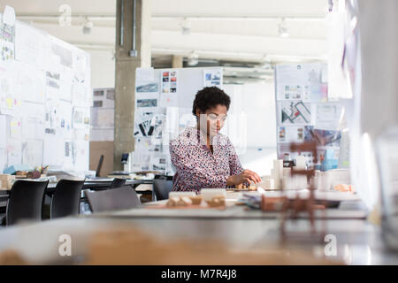 Architect working on scale model Stock Photo