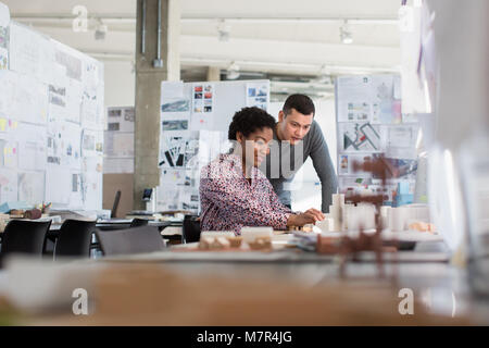 Architects working on scale model Stock Photo
