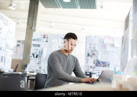 Young adult male working in creative office Stock Photo