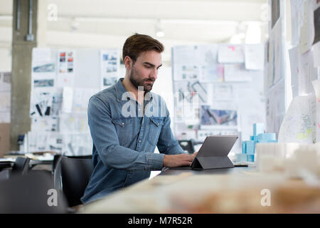 Young adult male working in creative office Stock Photo