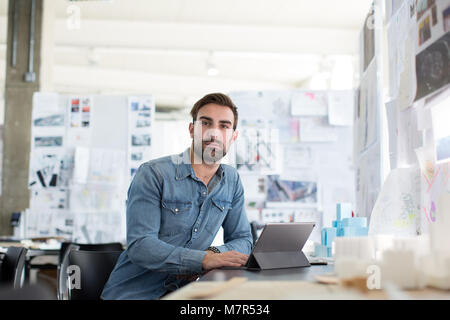 Young adult male working in creative office Stock Photo