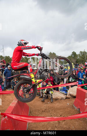 LA NUCIA, SPAIN - FEBRUARY 11th 2018: Unknown rider masters an obstacle at the Spanish National Trial Championship. Stock Photo