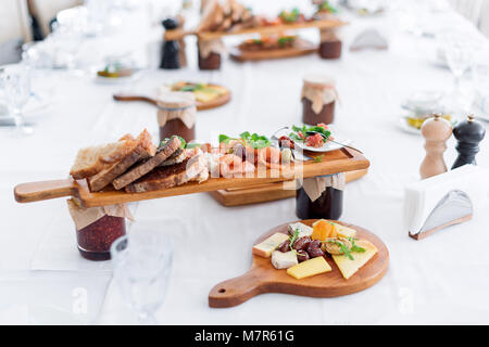 Delicious food. Different meals for the guests on the table in restaurant. Healthy mediterranean cuisine. Stock Photo