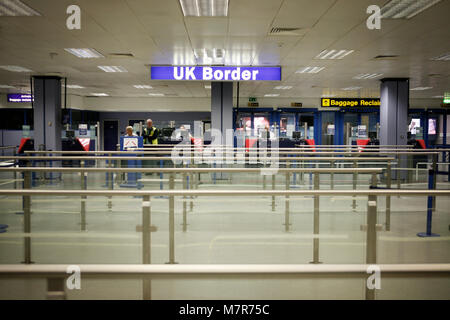 Passport control. HM UK Border Agency, Manchester Airport. Stock Photo